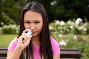 woman-using-nasal-spray-front-view